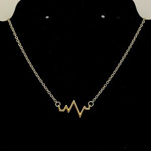 Charming Charlie Gold Tone Heartbeat Necklace